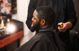 Image of a person getting a haircut (barbing)
